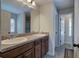 Double vanity bathroom with updated fixtures and floor tile at 113 Omega Ct, Dallas, GA 30157