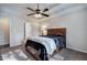 Main bedroom with ceiling fan, carpet and ensuite bathroom at 113 Omega Ct, Dallas, GA 30157