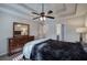 Main bedroom with tray ceiling, ceiling fan and ensuite bathroom at 113 Omega Ct, Dallas, GA 30157