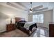 Main bedroom with tray ceiling, ceiling fan and natural light at 113 Omega Ct, Dallas, GA 30157