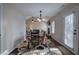 Bright dining room with table and chairs, near kitchen and living room at 113 Omega Ct, Dallas, GA 30157