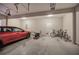 Two-car garage with bikes, lawnmower, and additional storage at 113 Omega Ct, Dallas, GA 30157