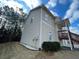 House exterior with light beige siding and landscaping at 113 Omega Ct, Dallas, GA 30157