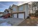 Two-story house with double garage and a covered front porch at 113 Omega Ct, Dallas, GA 30157