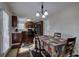 Modern kitchen with dark wood cabinets, black appliances, and granite countertops at 113 Omega Ct, Dallas, GA 30157