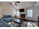 Living room with a stone fireplace and hardwood floors at 113 Omega Ct, Dallas, GA 30157