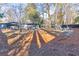 Landscaped backyard with firepit and pergola at 1810 Kinridge Rd, Marietta, GA 30062