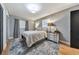 Bedroom with a queen-size bed and gray walls at 1810 Kinridge Rd, Marietta, GA 30062