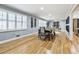 Elegant dining room with hardwood floors, a wine rack, and large windows with plantation shutters at 1810 Kinridge Rd, Marietta, GA 30062