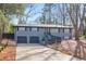 Gray ranch house with a two-car garage and landscaped yard at 1810 Kinridge Rd, Marietta, GA 30062