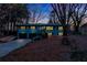 Evening view of home showing updated exterior and landscaping at 1810 Kinridge Rd, Marietta, GA 30062