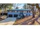 Ranch house with gray siding, black accents, and two-car garage at 1810 Kinridge Rd, Marietta, GA 30062