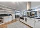 Renovated kitchen with an island, white cabinets, and black marble countertops at 1810 Kinridge Rd, Marietta, GA 30062