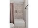 Clean bathroom with marble tile shower/tub combo at 23304 Plantation Ne Dr # 304, Atlanta, GA 30324