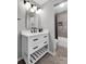 Modern bathroom with white vanity, marble tile, and bathtub at 23304 Plantation Ne Dr # 304, Atlanta, GA 30324