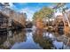 Serene pond with fountain, surrounded by lush trees at 23304 Plantation Ne Dr # 304, Atlanta, GA 30324