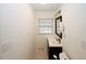 Small bathroom with vanity, toilet and patterned floor at 4924 River Rd, Ellenwood, GA 30294