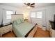 Charming bedroom with a queen bed and updated nightstands at 4924 River Rd, Ellenwood, GA 30294