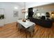 Open concept dining area with marble table and hardwood floors at 4924 River Rd, Ellenwood, GA 30294