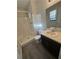 Bathroom with shower, toilet, vanity, and laminate floor at 5451 Zachary Dr, Stone Mountain, GA 30083