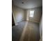 Well-lit bedroom with carpeted floor and large window at 5451 Zachary Dr, Stone Mountain, GA 30083