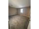 Large bedroom with carpeted floor and window at 5451 Zachary Dr, Stone Mountain, GA 30083