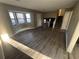 Spacious living room featuring hardwood floors and a staircase at 5451 Zachary Dr, Stone Mountain, GA 30083