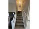 Carpeted staircase leading to the upper level of the home at 5451 Zachary Dr, Stone Mountain, GA 30083