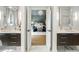 Double vanity bathroom with marble flooring and a view into the main bedroom at 595 Sherwood Ne Rd, Atlanta, GA 30324