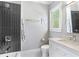 Clean bathroom with dark geometric tile and a modern vanity at 595 Sherwood Ne Rd, Atlanta, GA 30324