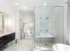 Modern bathroom with a large walk-in shower and marble finishes at 595 Sherwood Ne Rd, Atlanta, GA 30324