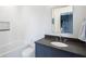 Clean bathroom with a bathtub and dark vanity at 595 Sherwood Ne Rd, Atlanta, GA 30324