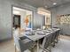 Formal dining room, marble table, gray walls, and chandelier at 595 Sherwood Ne Rd, Atlanta, GA 30324