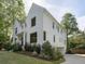 Two-story white brick home with landscaped lawn and driveway at 595 Sherwood Ne Rd, Atlanta, GA 30324