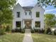 Stunning two-story home with white brick facade and black windows at 595 Sherwood Ne Rd, Atlanta, GA 30324