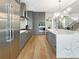 Modern kitchen with gray cabinetry and marble countertops at 595 Sherwood Ne Rd, Atlanta, GA 30324