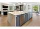 Modern kitchen island with white marble countertop and stainless steel appliances at 595 Sherwood Ne Rd, Atlanta, GA 30324