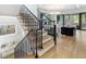 Elegant staircase with metal railing and hardwood floors at 595 Sherwood Ne Rd, Atlanta, GA 30324