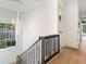 Light-filled upper hallway with hardwood floors at 595 Sherwood Ne Rd, Atlanta, GA 30324