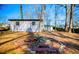 Large backyard with fire pit and mature trees at 1991 Judy Se Cir, Marietta, GA 30060