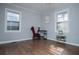 Cozy bedroom featuring hardwood floors, large windows, and a home office space at 1991 Judy Se Cir, Marietta, GA 30060