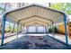 Covered carport with ample parking for multiple vehicles at 1991 Judy Se Cir, Marietta, GA 30060