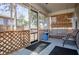 Cozy screened porch with seating and tranquil view at 1991 Judy Se Cir, Marietta, GA 30060