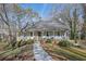 Gray house with wrap around porch and landscaped yard at 3796 Hickory Ridge Ct, Marietta, GA 30066