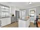 Kitchen with white cabinets, granite island, and stainless steel appliances at 3796 Hickory Ridge Ct, Marietta, GA 30066