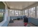 Relaxing screened porch with wood flooring and a grill at 3796 Hickory Ridge Ct, Marietta, GA 30066