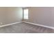 Empty bedroom with neutral walls and carpet at 4001 Village Crossing Cir, Ellenwood, GA 30294