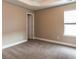 Spacious bedroom with neutral walls and carpet at 4001 Village Crossing Cir, Ellenwood, GA 30294