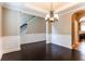 Elegant dining room with hardwood floors and chandelier at 4001 Village Crossing Cir, Ellenwood, GA 30294