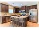 Kitchen boasts granite countertops and a large island with seating at 4001 Village Crossing Cir, Ellenwood, GA 30294